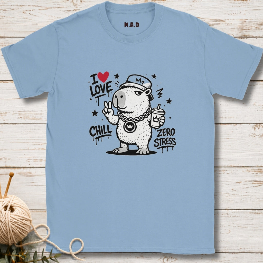 Light blue t-shirt with a bear graphic and text on a wooden surface
