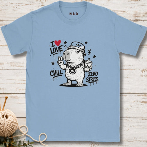 Light blue t-shirt with a bear graphic and text on a wooden surface