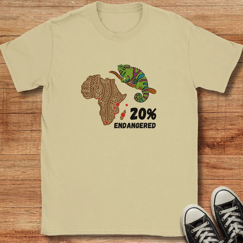 Beige t-shirt with a graphic of Africa, a chameleon, and text on a wooden surface