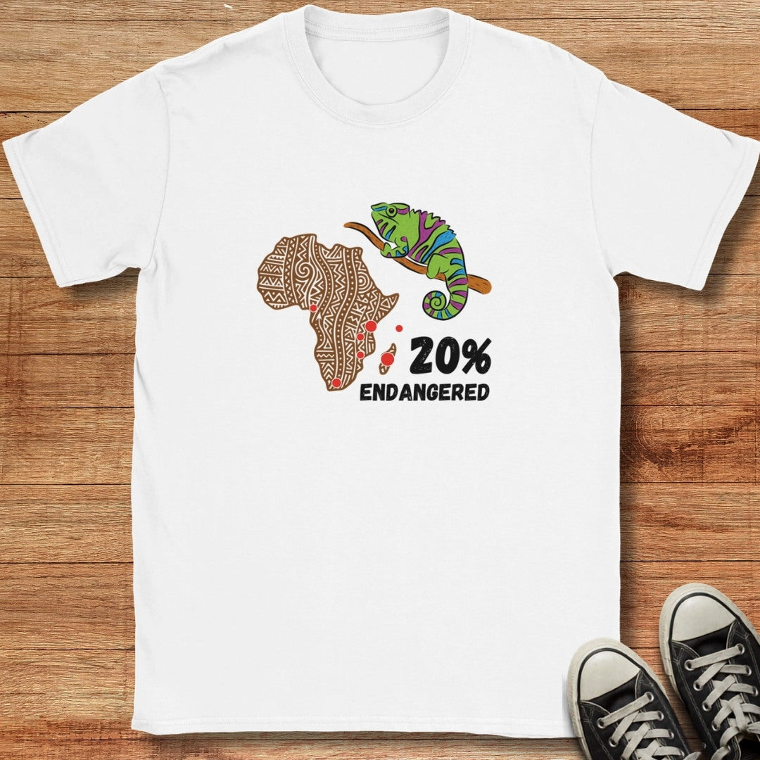 White t-shirt with a chameleon and Africa map design on a wooden surface