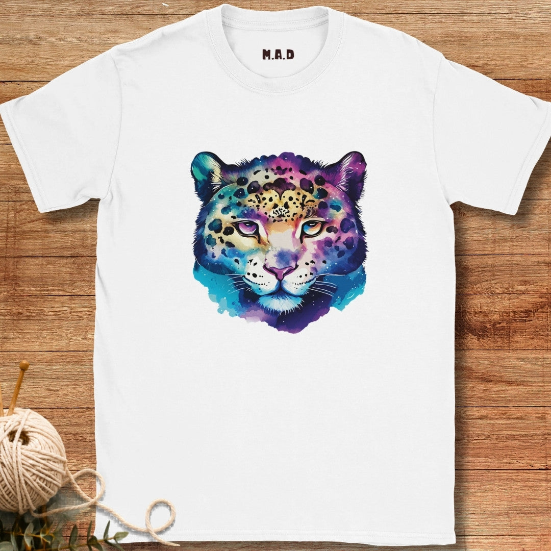 White t-shirt with a colorful leopard design on a wooden surface
