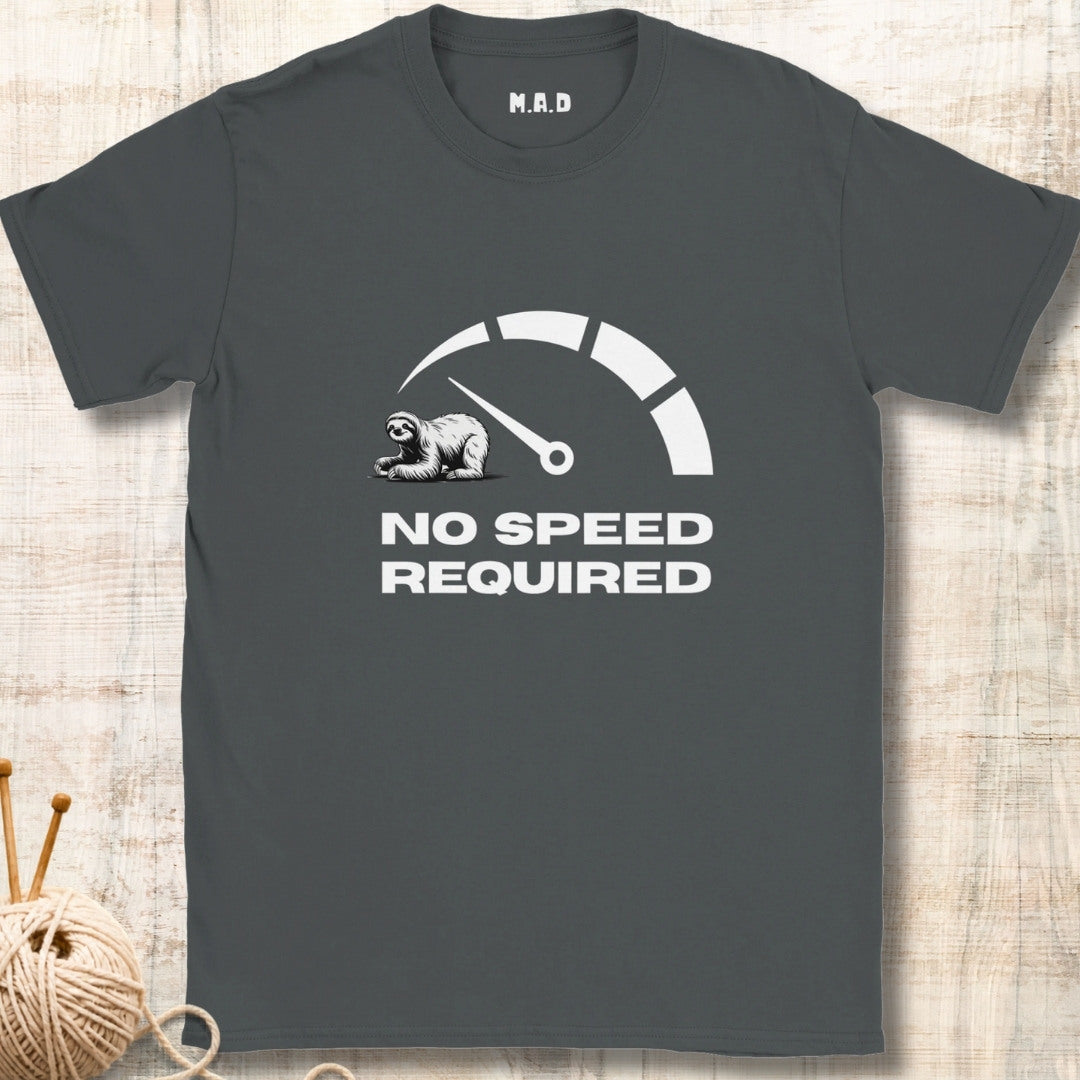 Gray t-shirt with a sloth graphic and 'No Speed Required' text on a wooden surface.