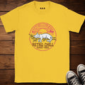 Yellow t-shirt with 'Retro Chill Sunset Vibes' design on a wooden surface