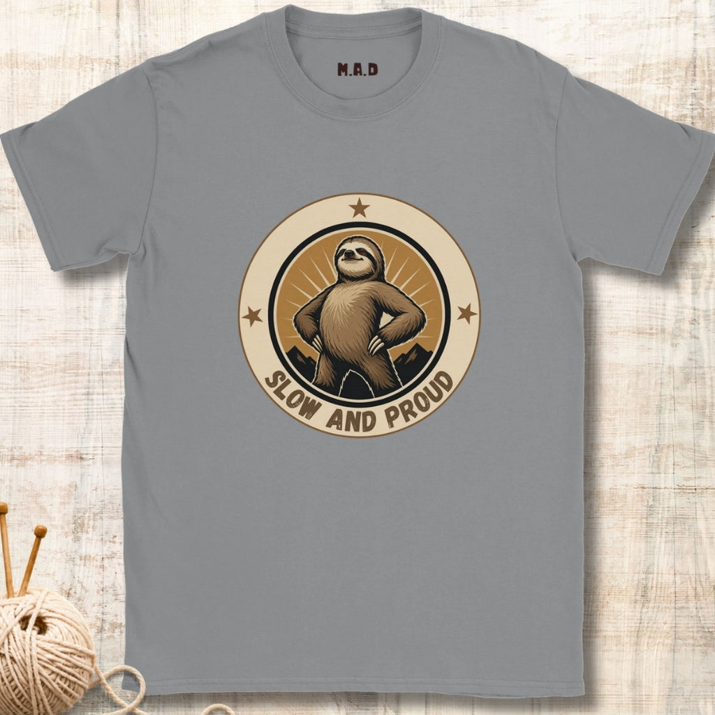 Gray t-shirt with a sloth graphic and 'Slow and Proud' text on a textured surface.
